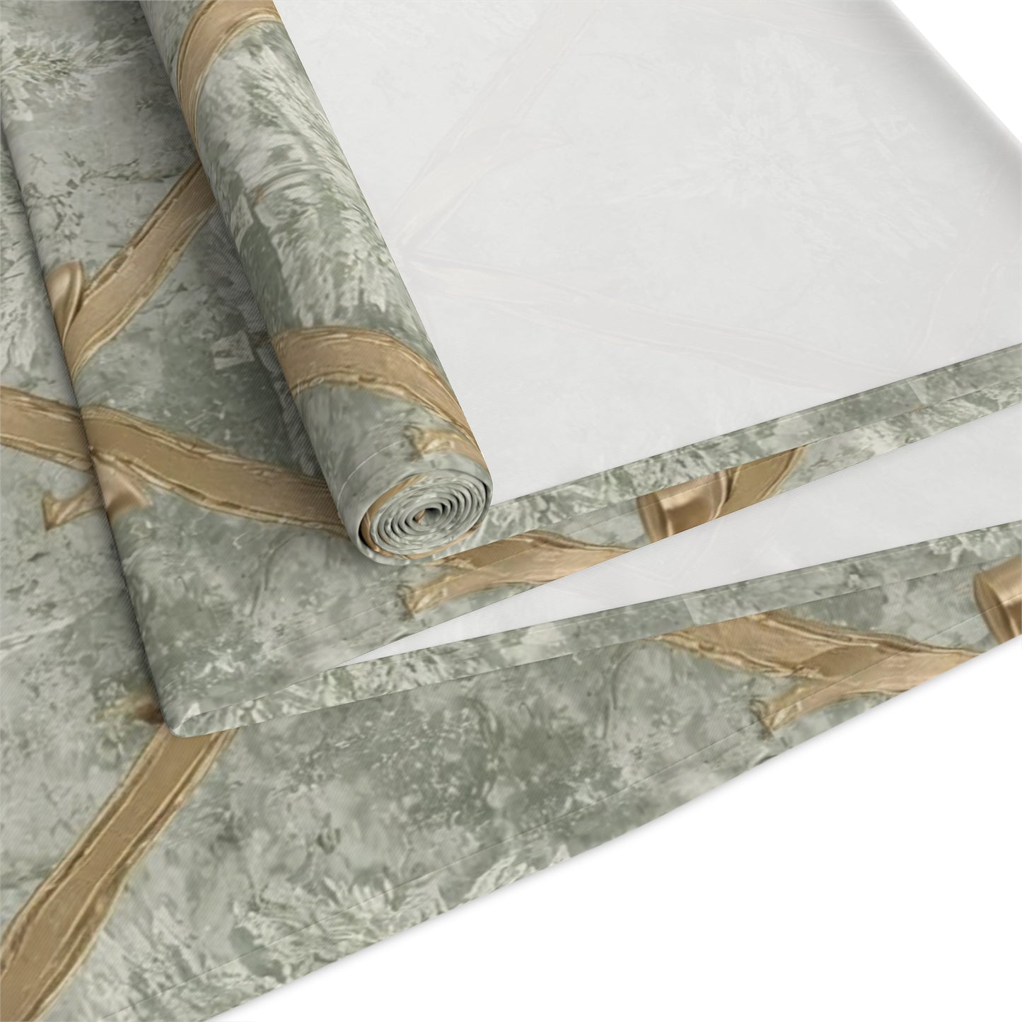Close-up of a French Country-style Christmas table runner textile with intricate gold satin ribbon and frosted pine tree motifs.
