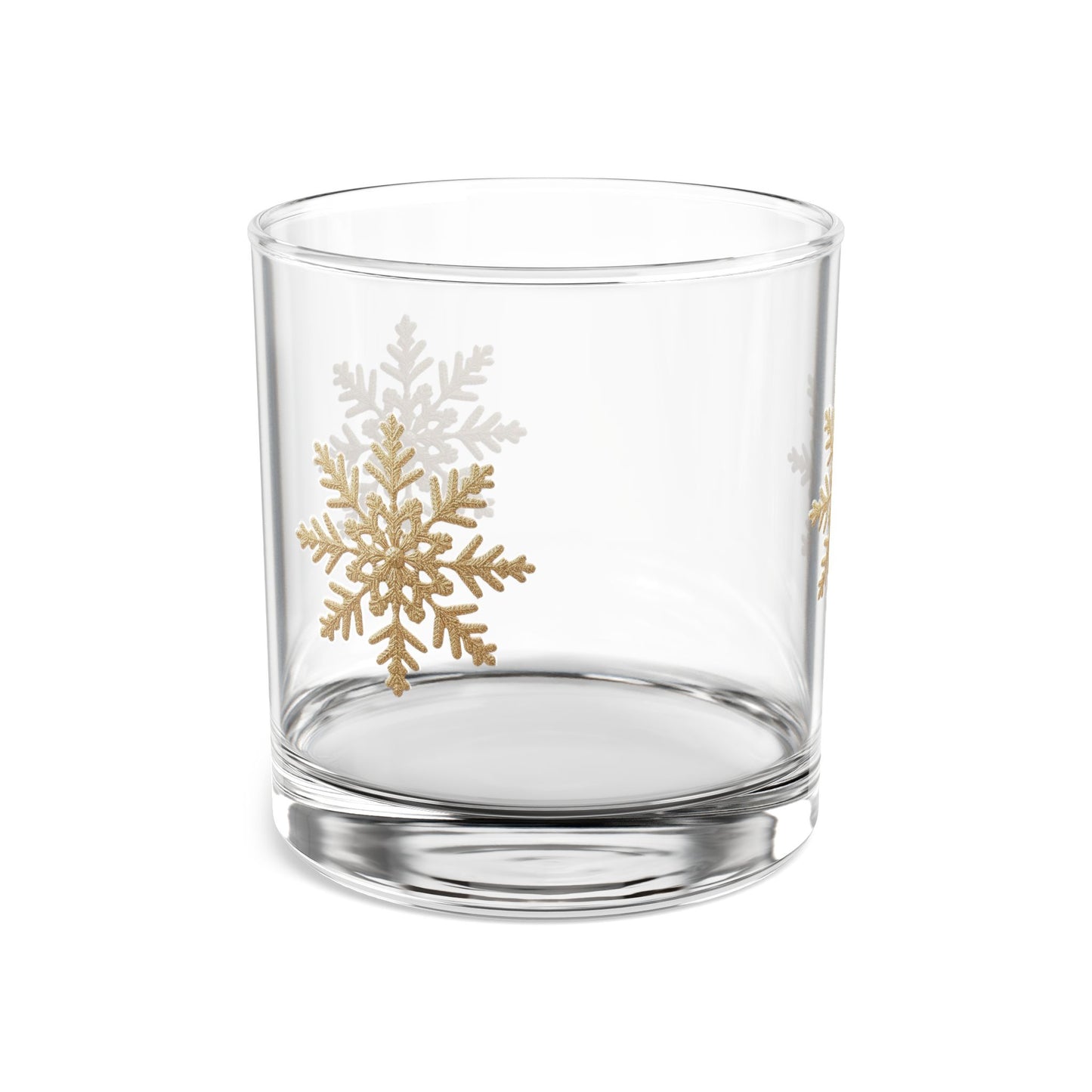 10 oz rocks glass displaying a winter snowflake design in gold, emphasizing the clear glass construction and thick base, ideal for holiday gift giving.