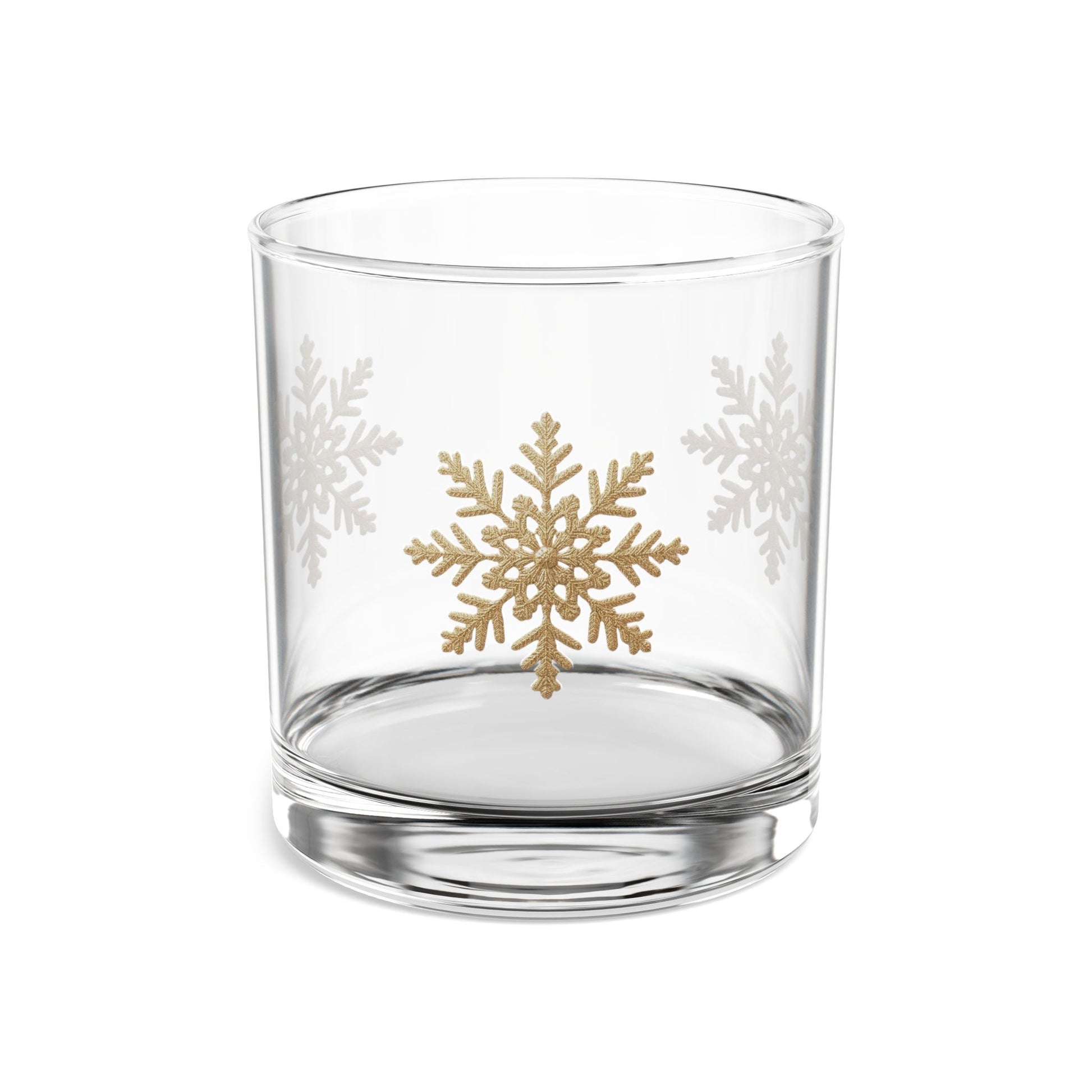 Elegant double old-fashioned whiskey tumbler featuring a pattern of delicate gold foil snowflakes.