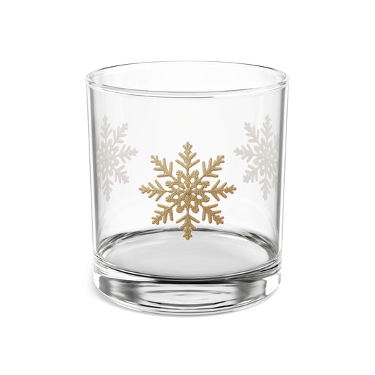 Elegant double old-fashioned whiskey tumbler featuring a pattern of delicate gold foil snowflakes.
