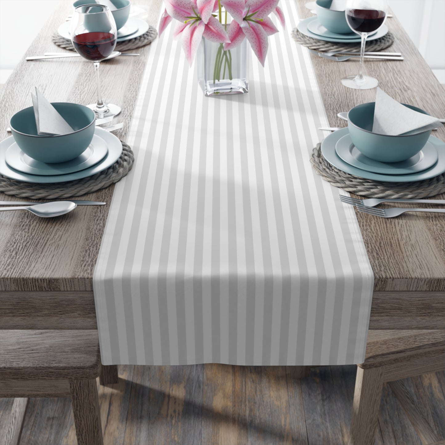 Modern coastal table setup with striped runner