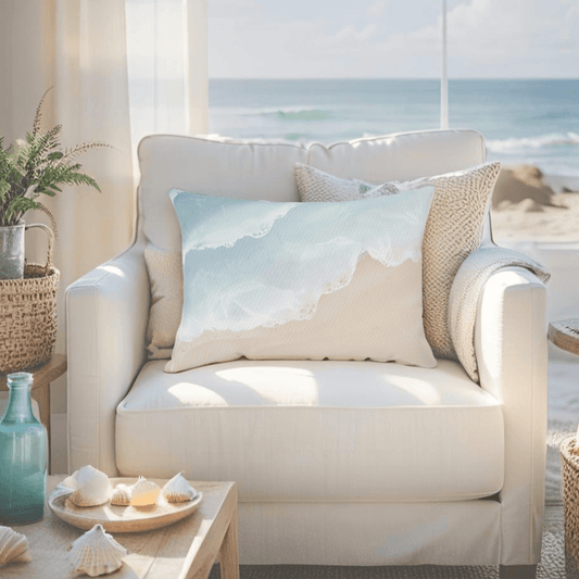 Beach-themed throw pillow featuring a minimalist shoreline design in soft neutral and ocean hues for a clean coastal aesthetic.