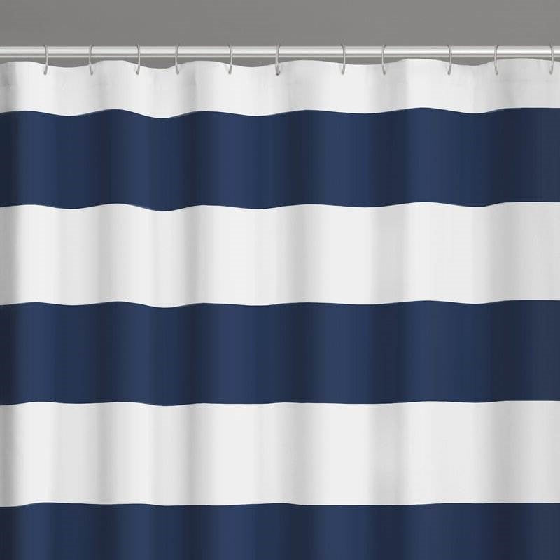 Modern coastal bathroom with navy and white shower curtain