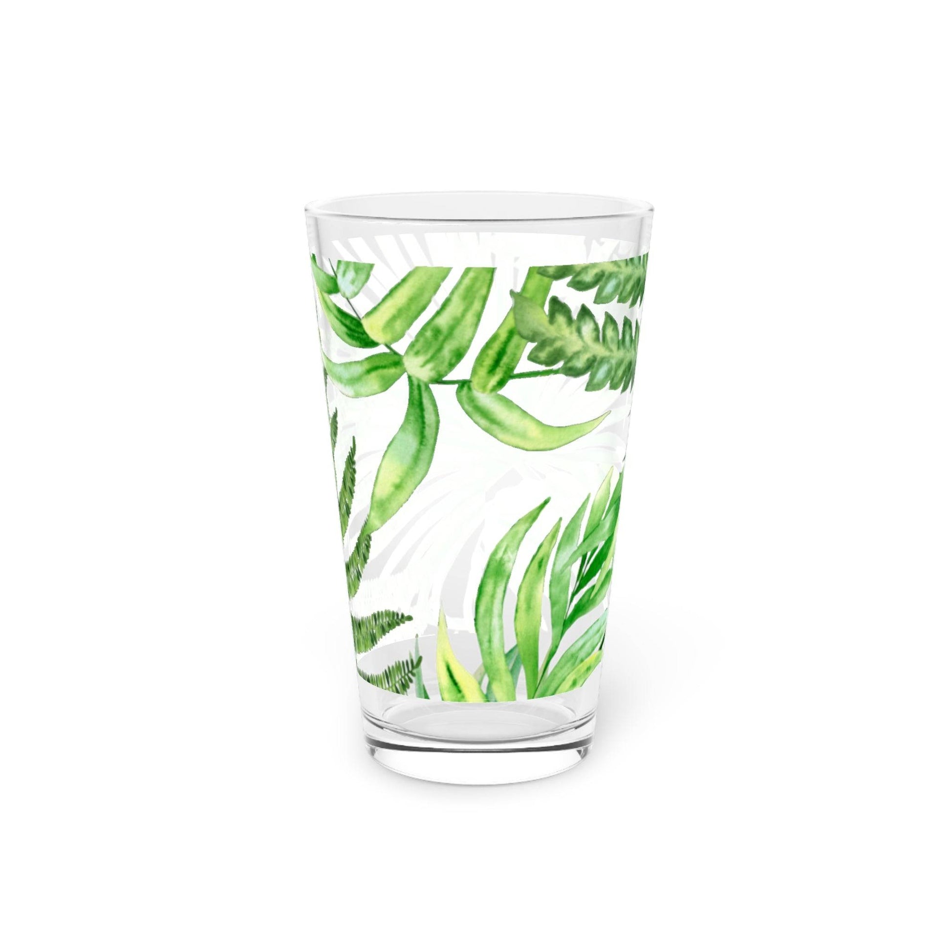 Coastal-style pint glass with tropical leaves, perfect for ocean-themed kitchens.