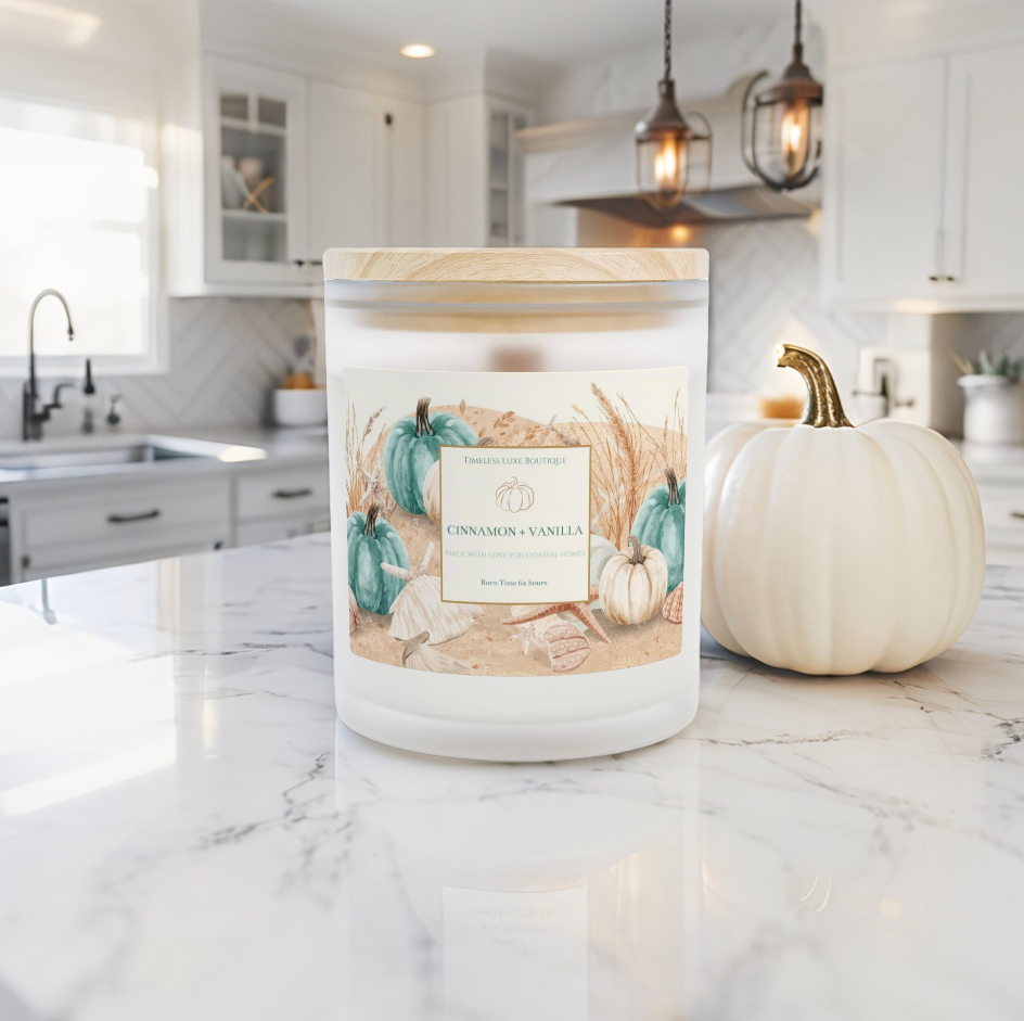 Fall coastal cinnamon vanilla candle on a coffee table in a luxury beach house.