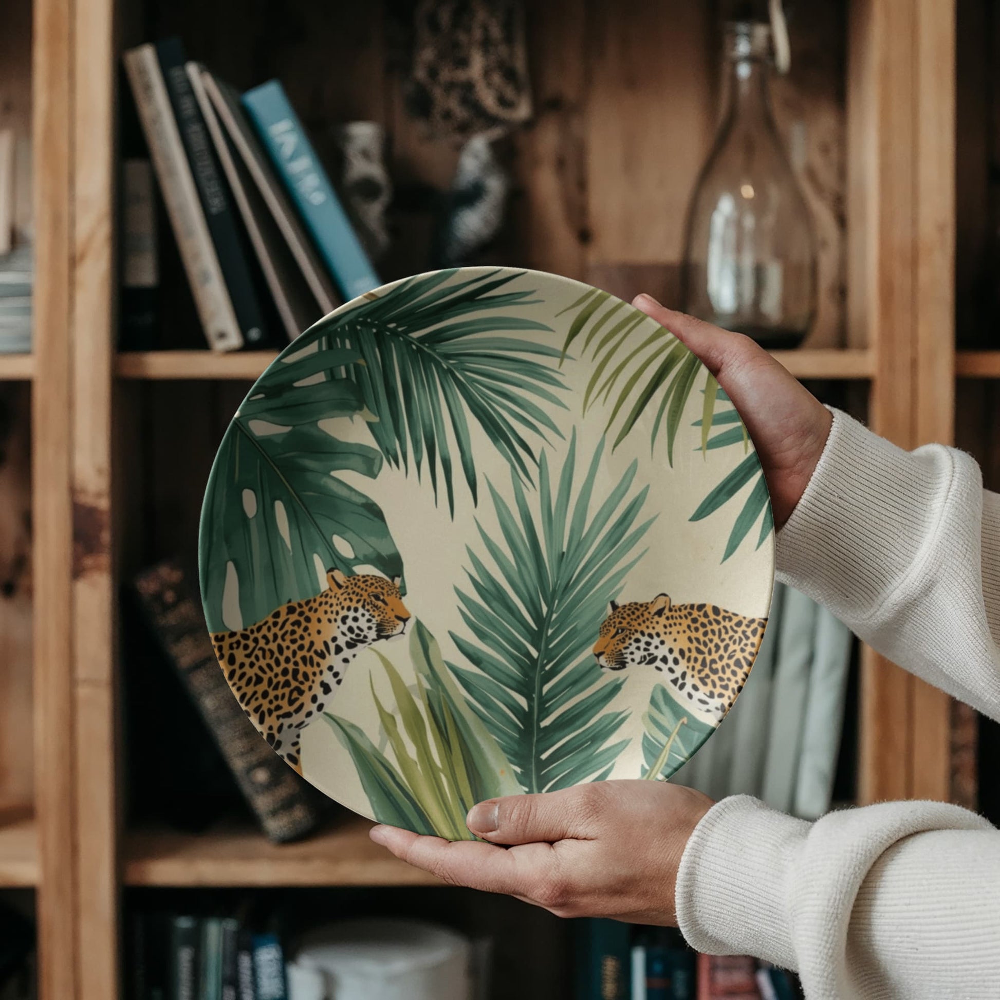 Close-up detail of the high-end ceramic material and hand-painted style jaguar print texture on the dinner plate.