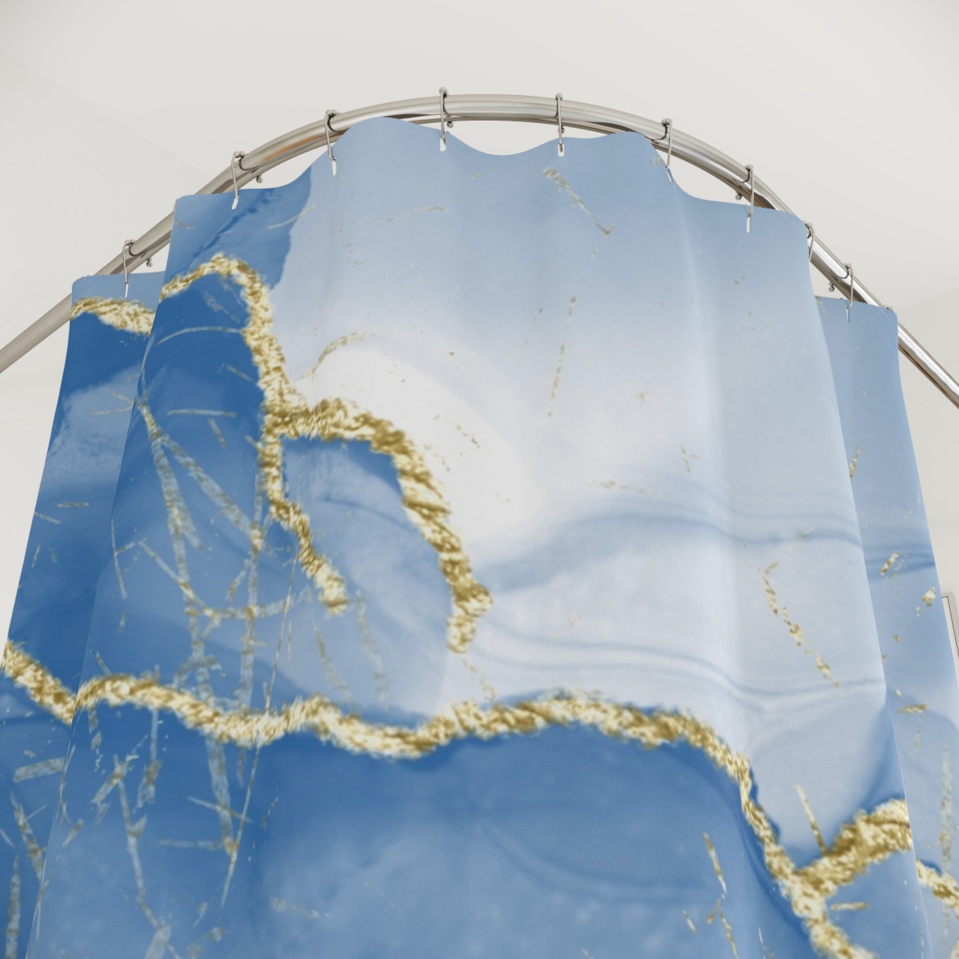 Coastal marble shower curtain featuring elegant blue and gold design