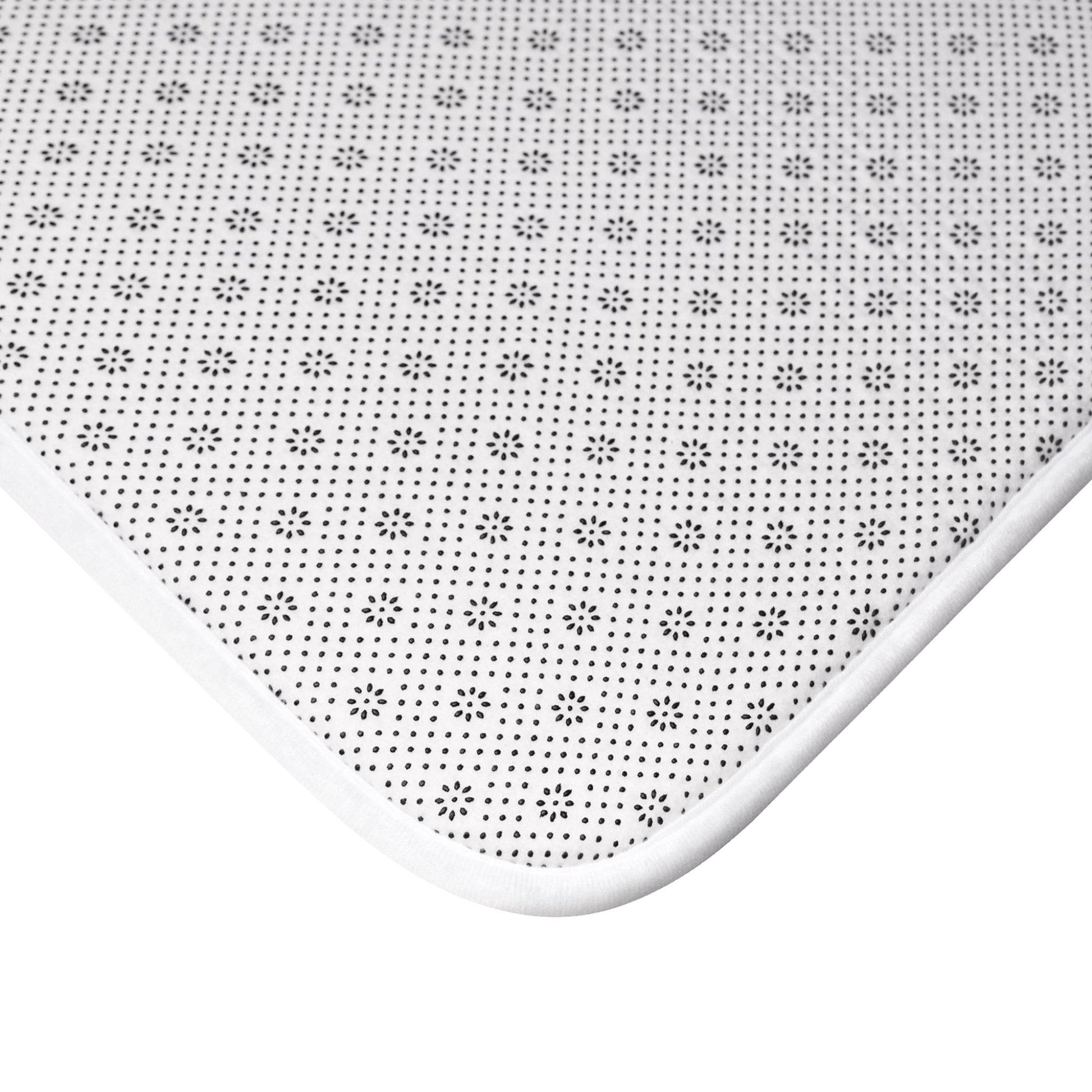 Minimalist monochrome floral bath mat, a sleek and modern twist on botanical decor.