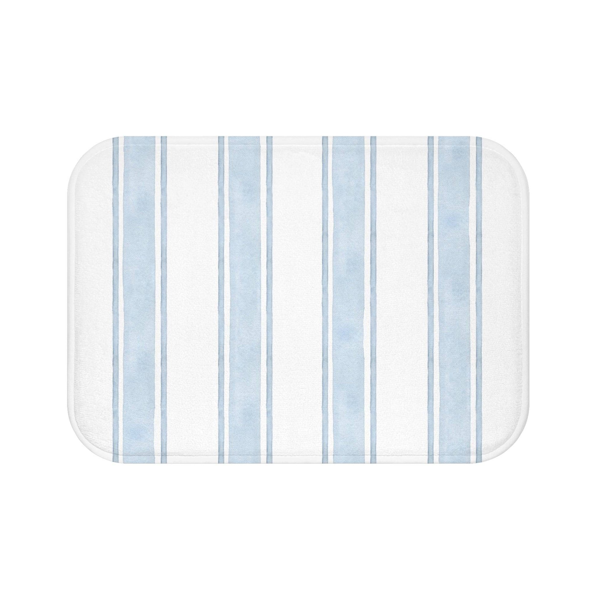 Beachy coastal bath mat with horizontal blue and white stripes