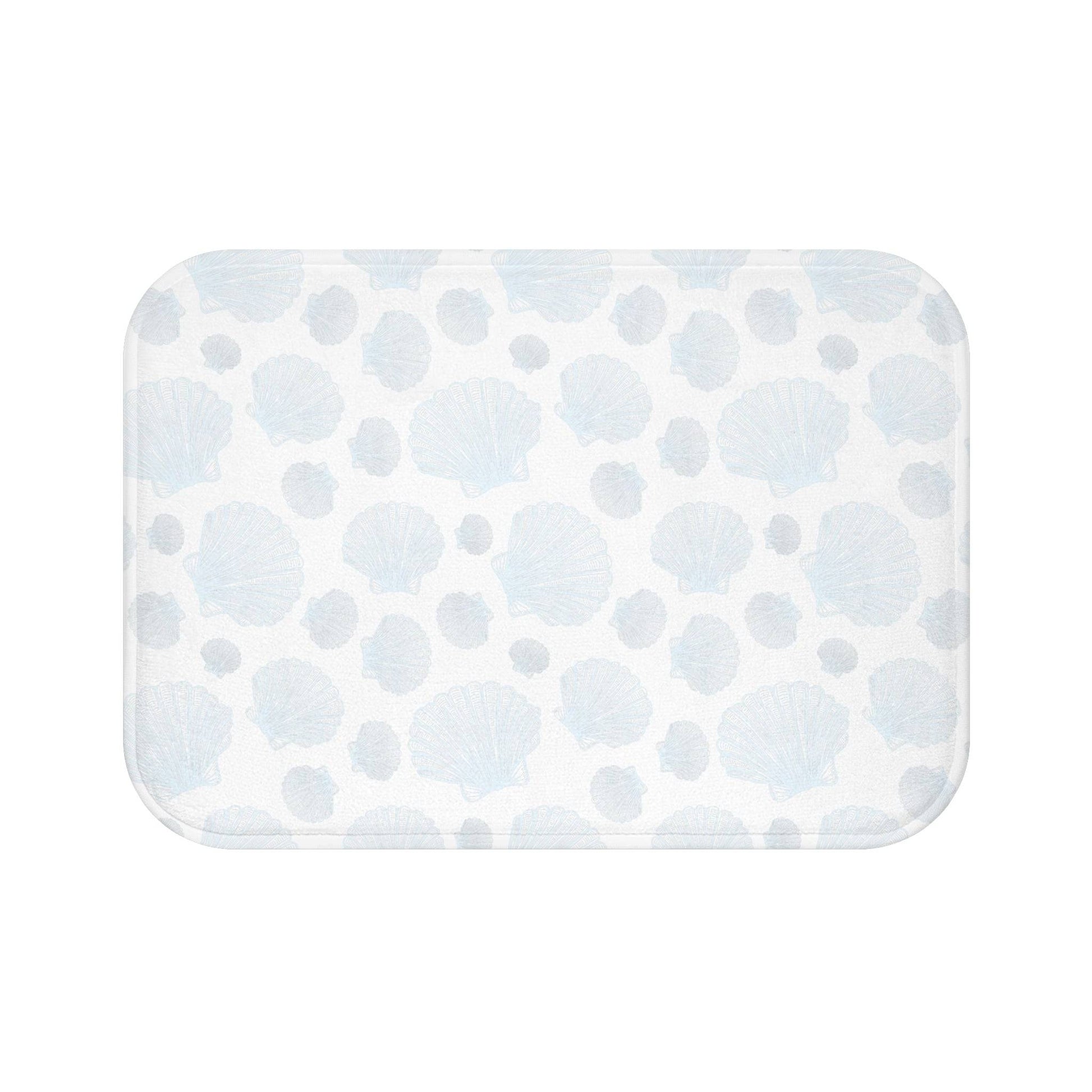 Nautical-themed bath mat featuring seashell and rope accents, perfect for a maritime bathroom style