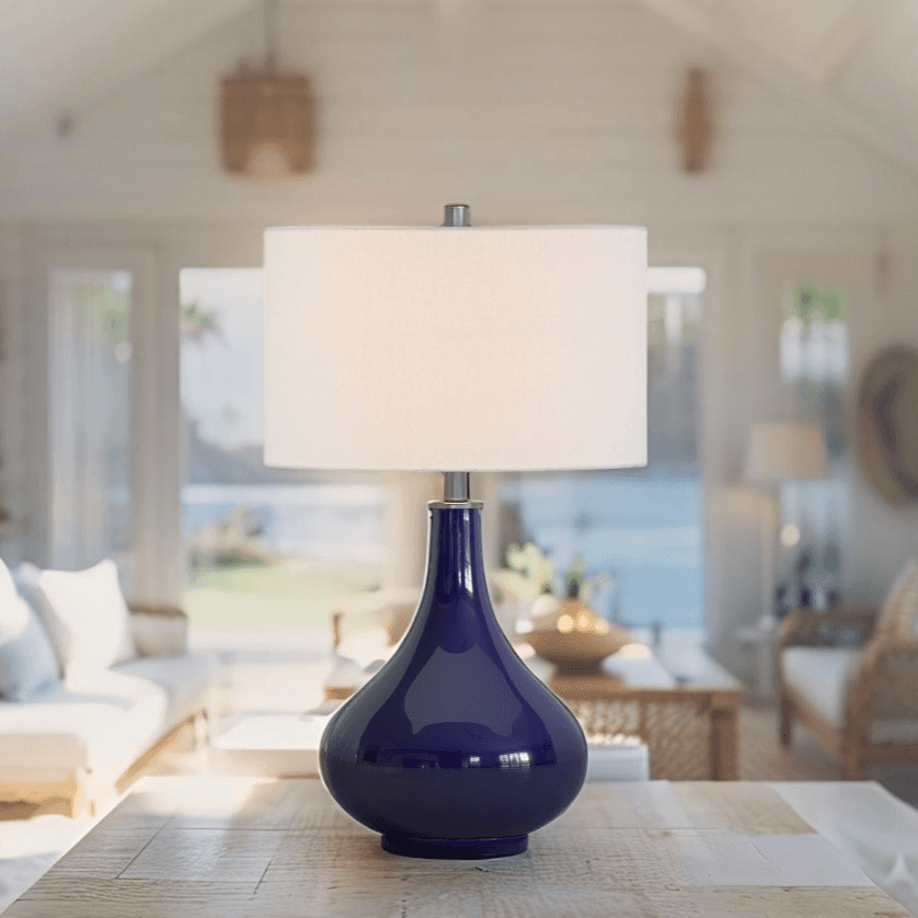 Navy blue glass table lamp with white drum shade for coastal decor