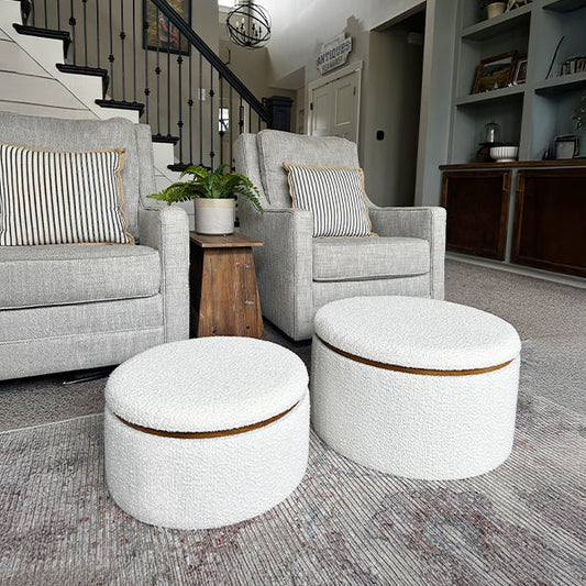 Pair of plush boucle ottomans with soft textured upholstery