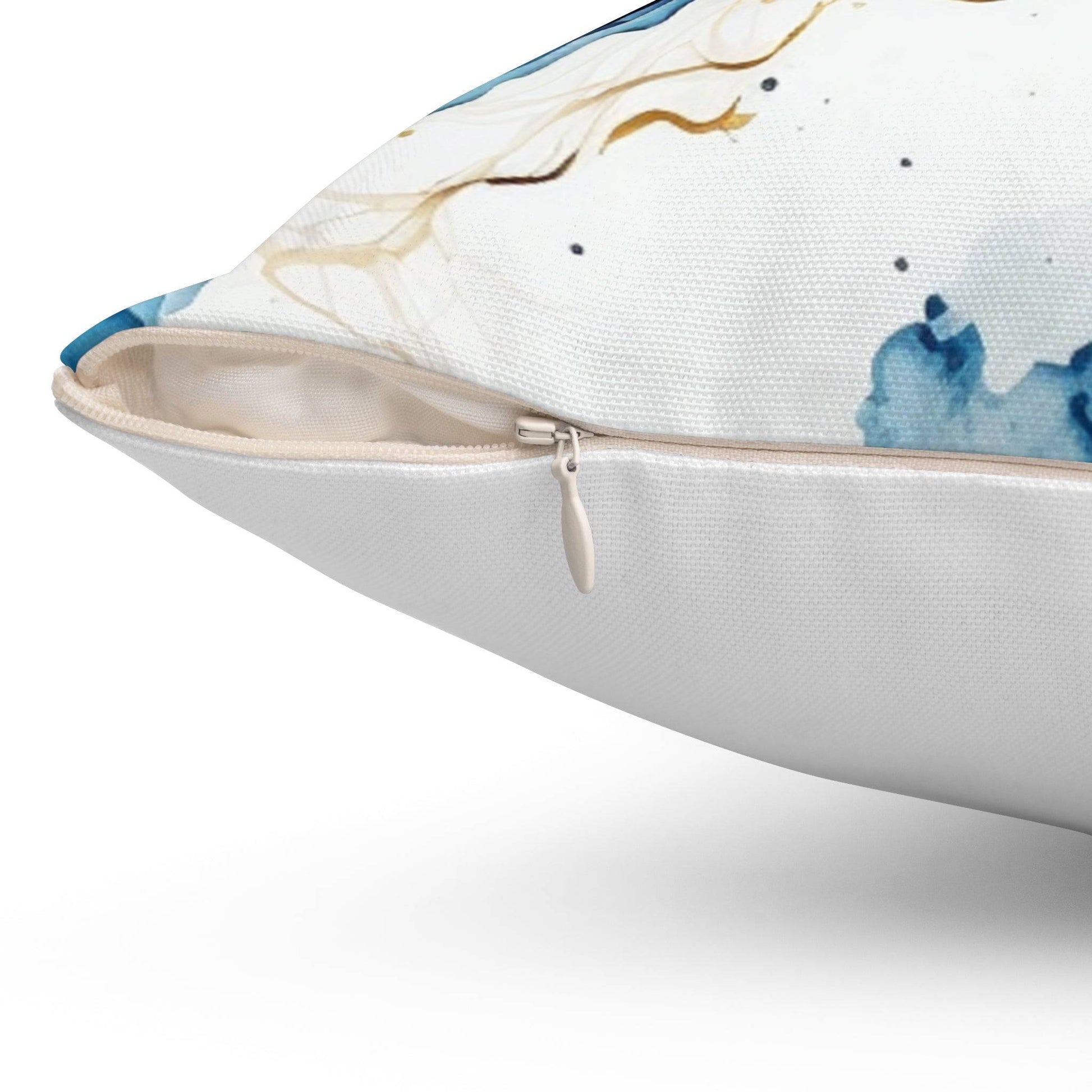 Seafoam and blue pillow on white sofa