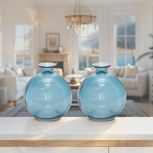 Set of two blue glass round table vases, front view