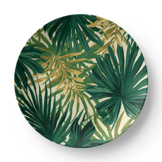 Elegant tropical tableware set placed on a patio table, featuring the palm leaf dinner plate and a glass of water.
