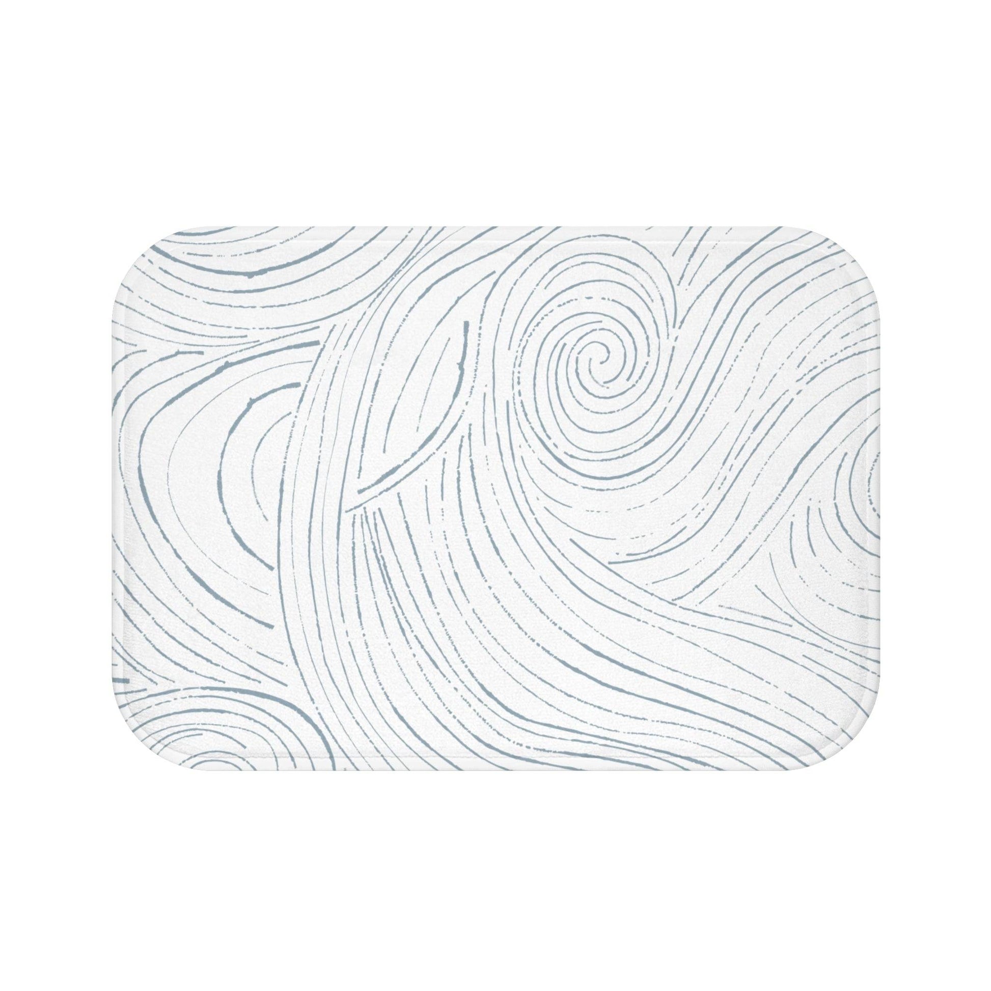 Beach-inspired bath mat featuring ocean waves and soft sand tones
