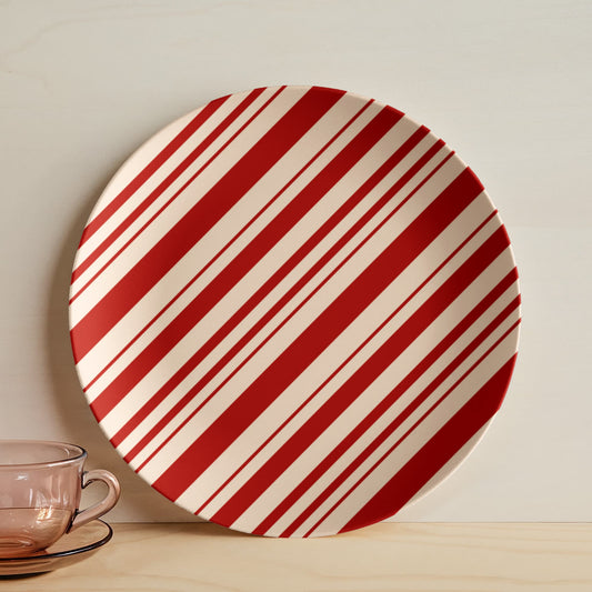 10 inch ceramic Christmas dinner plate with red and white candy cane stripes.