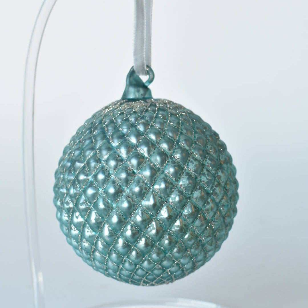 4-inch Ice Blue Diamond Quilted Christmas Ornament for Winter Wonderland decor.