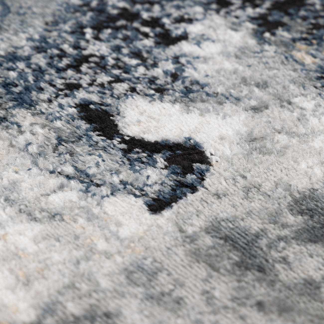 A stylish and affordable contemporary style rug in a marble pattern, offering high value.