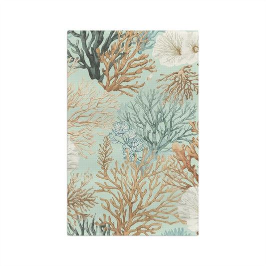 Decorative towel with coral and sea anemone pattern on a light blue background