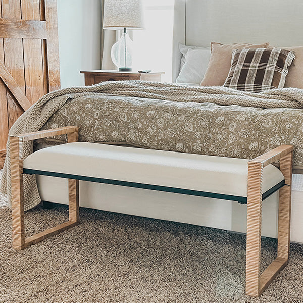 Beachy wooden bench with woven rattan details for relaxed coastal décor.