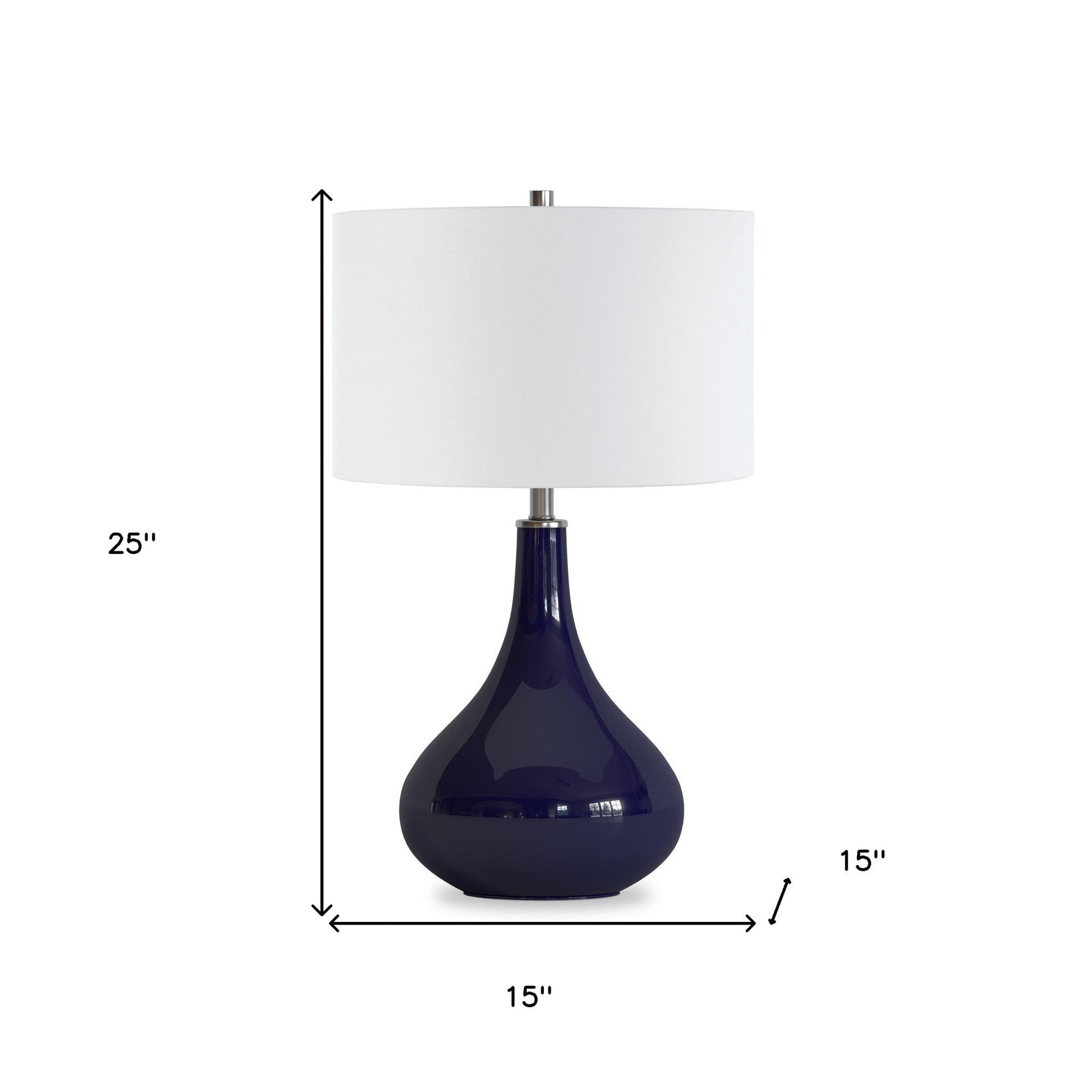 Blue glass table lamp with white shade styled on entryway console