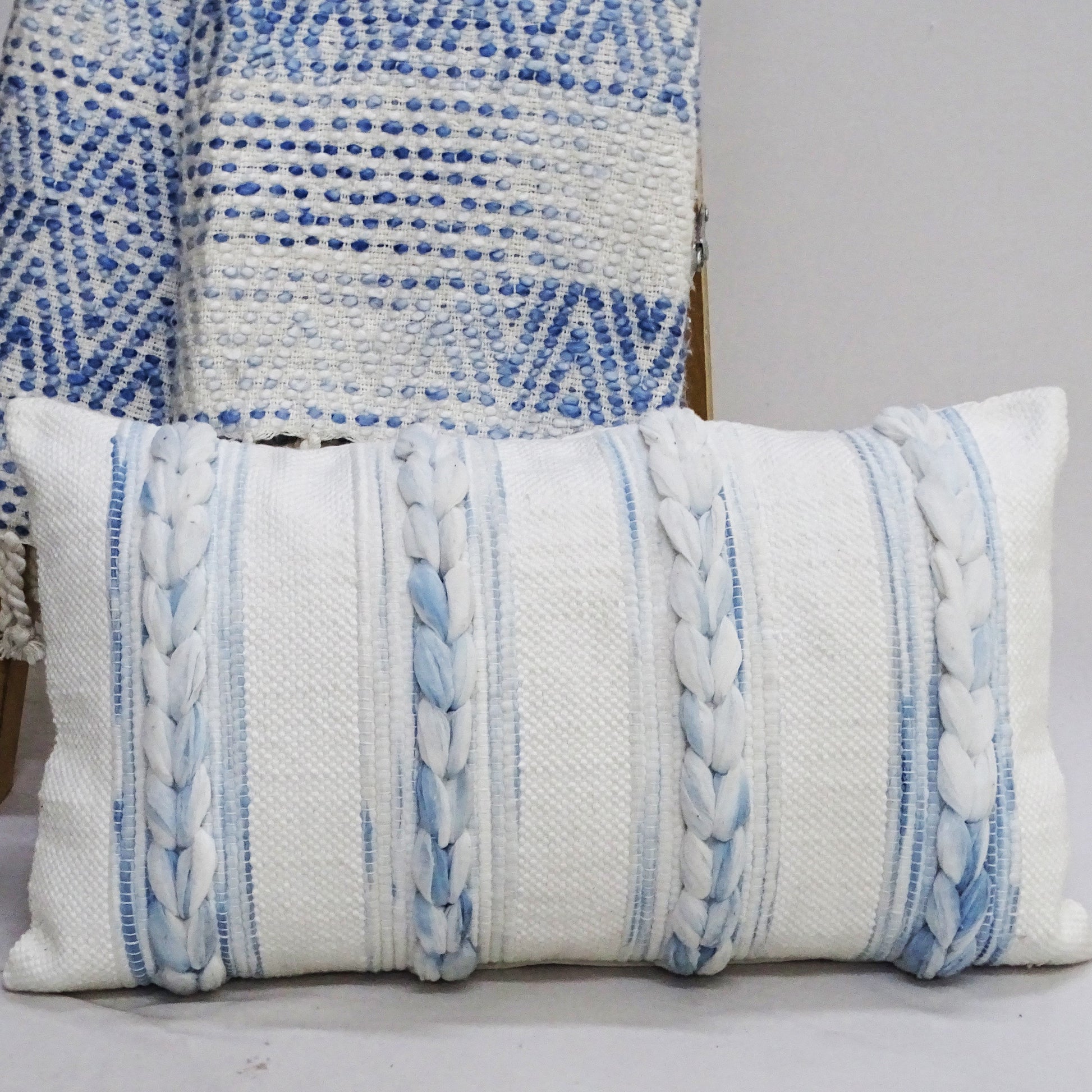 Coastal blue and white striped lumbar pillow with rope detail 14x24
