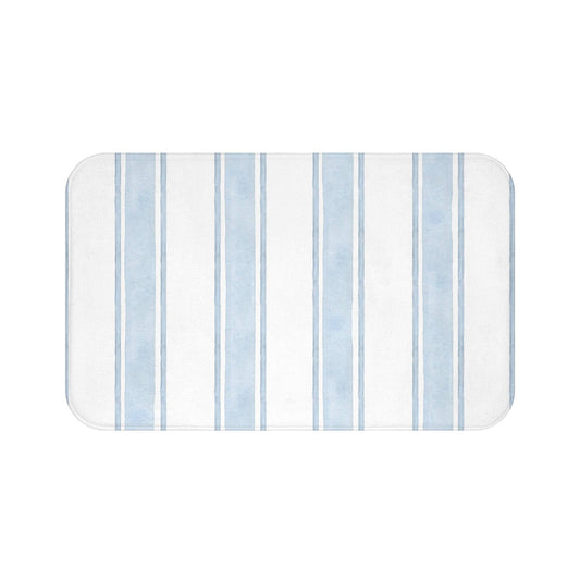 Nautical-inspired striped bath rug in light blue tones