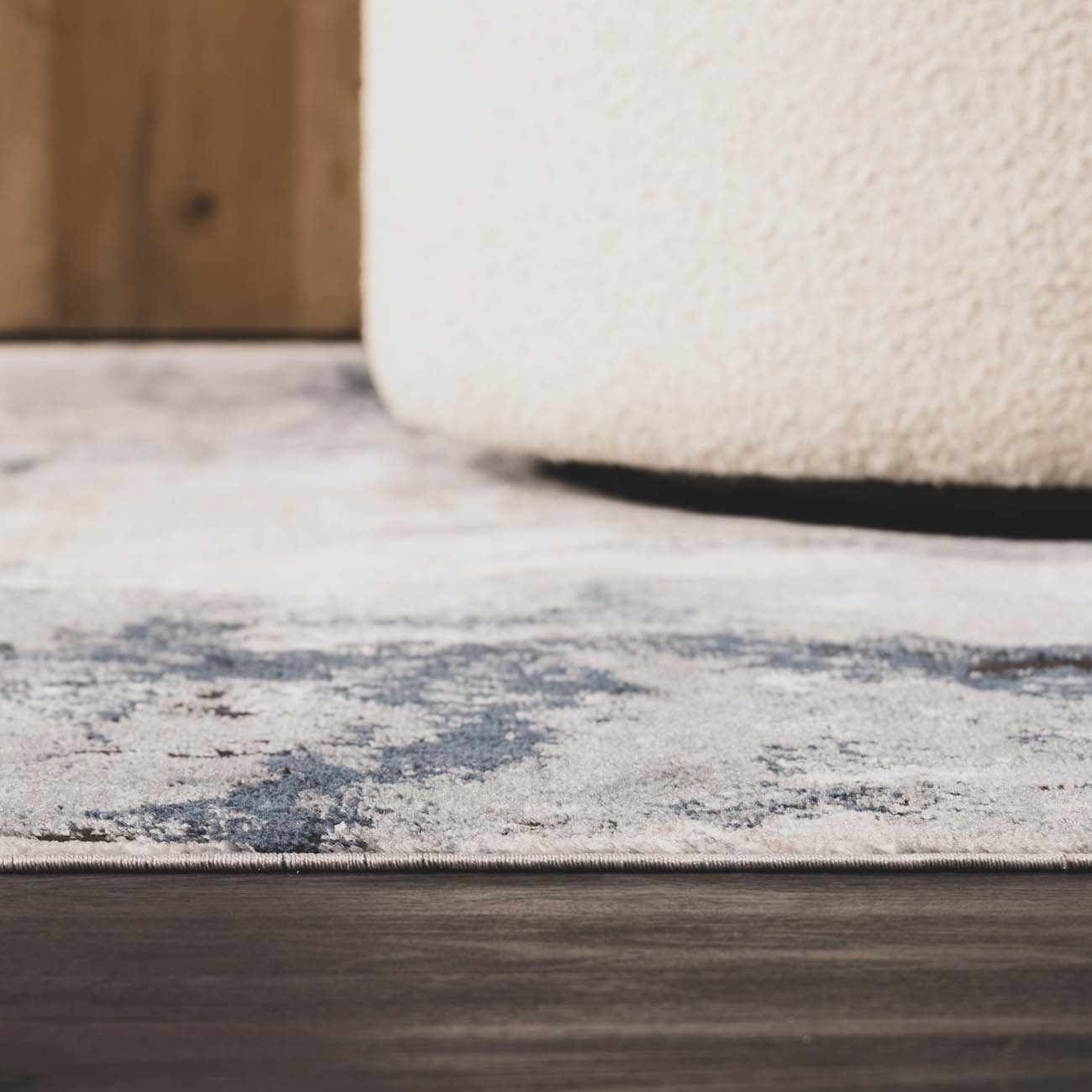 Marble-pattern detail showing the contrast between dark charcoal and soft light gray veins.