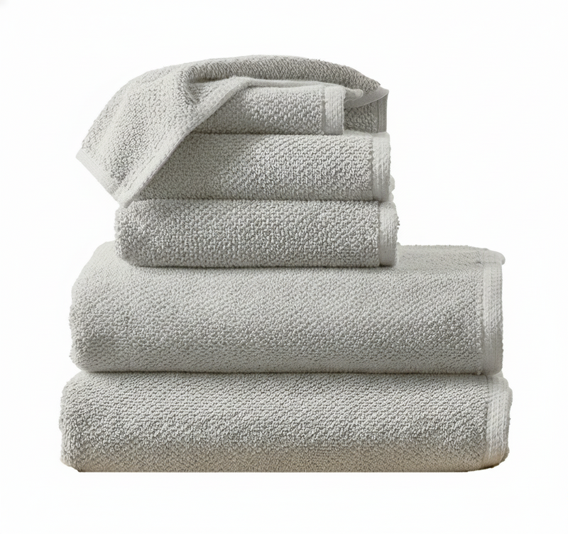 Stack of gray towels on a white background