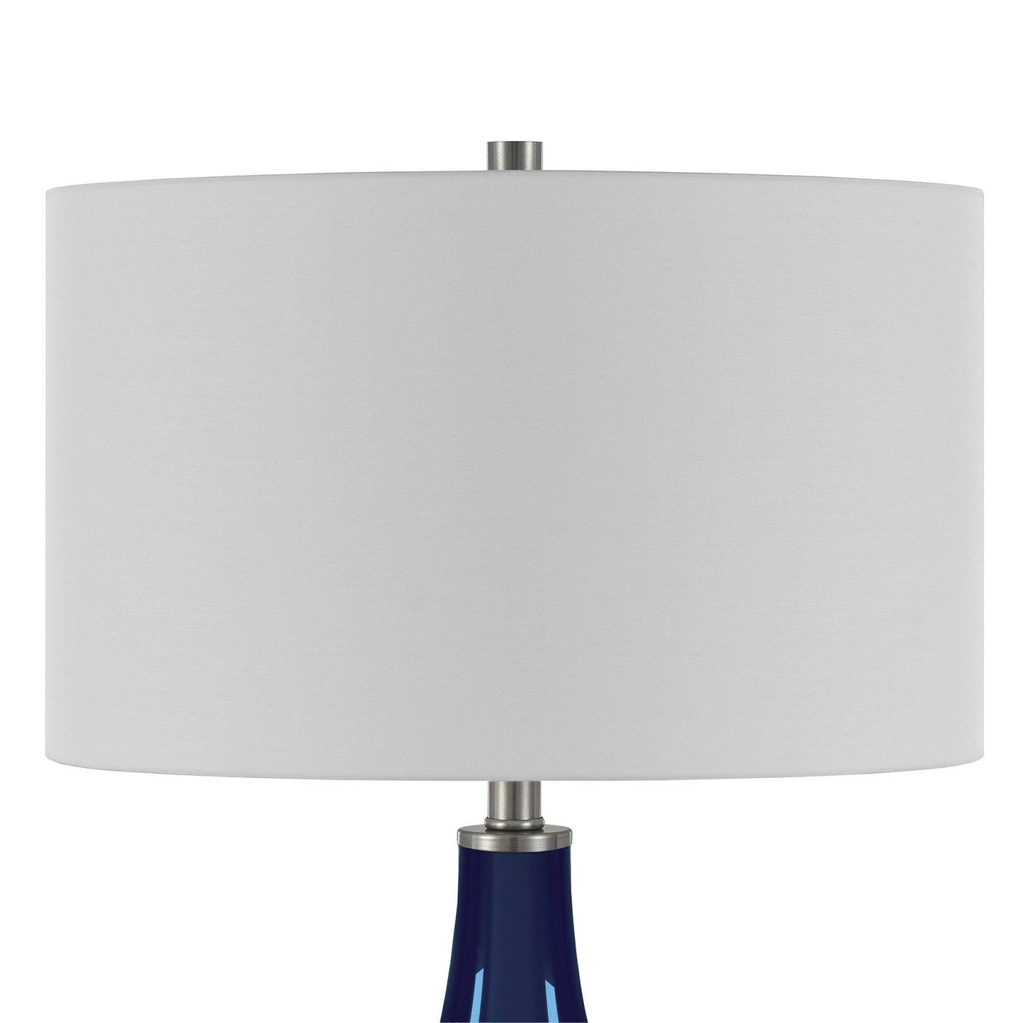 Modern navy blue gourd lamp providing ambient lighting in coastal home