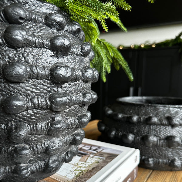 Modern matte black outdoor planter set with hobnail-inspired texture