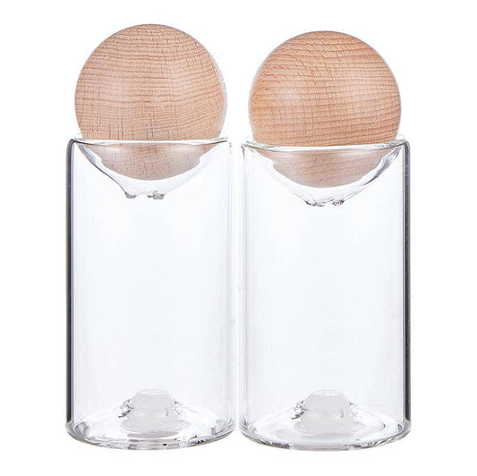 Two clear glass containers with wooden lids 