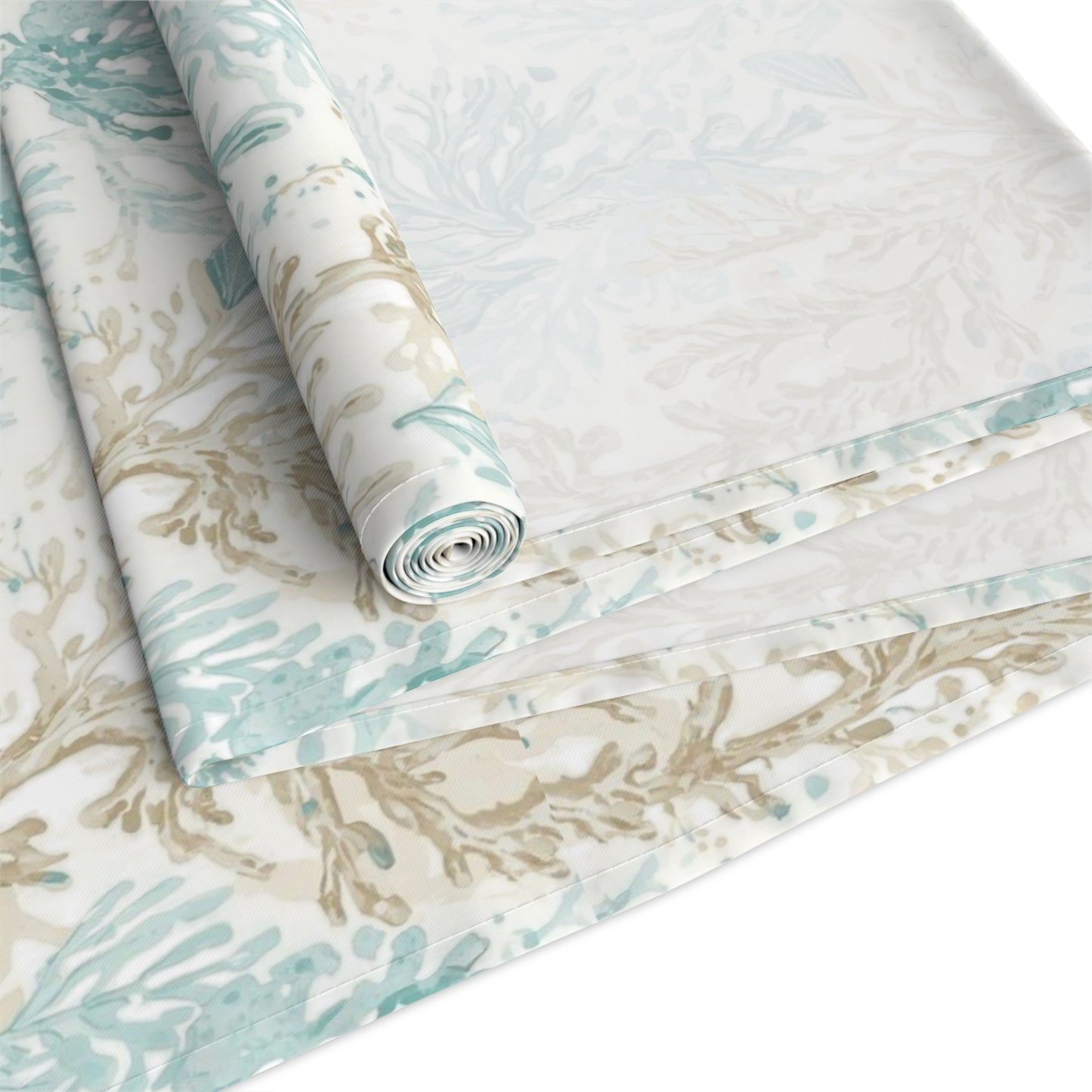 Beach theme centerpiece on coral and blue table runner