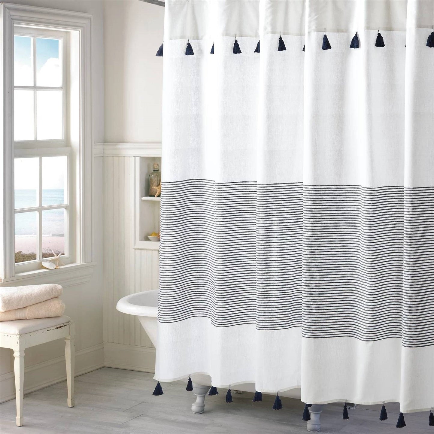 Navy and white coastal striped cotton shower curtain with tassel hem