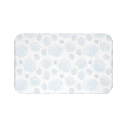 Ocean blue bath mat with delicate seashell designs, bringing a coastal touch to your home