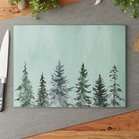 Watercolor pine tree glass cutting board and matching cocktail napkins holiday entertaining gift set.