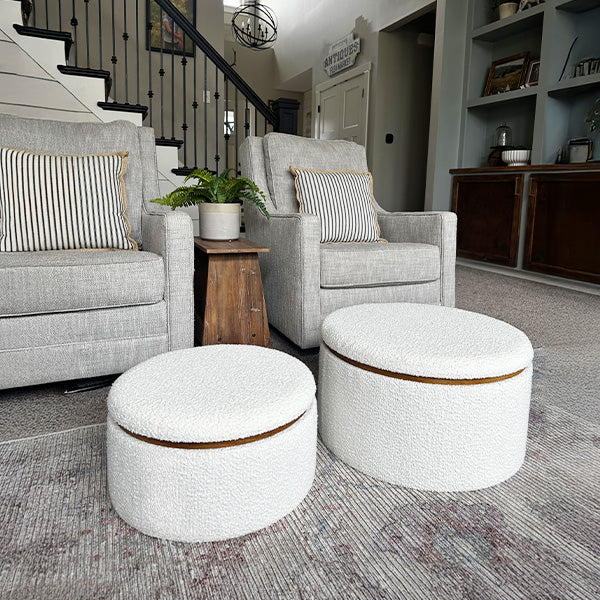 Pair of plush boucle ottomans with soft textured upholstery