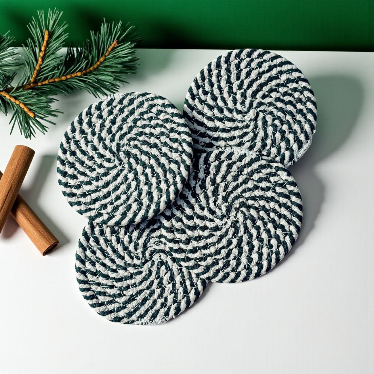 Set of 4 holiday coasters with a red and green stripe design, wrapped with a ribbon, a great Christmas gift idea.