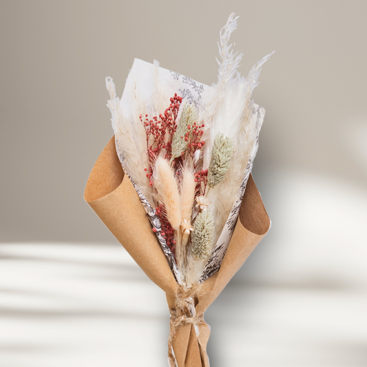 Close-up of the rosy pink and red everlasting dried floral bouquet, perfectly sized as a small tabletop centerpiece.