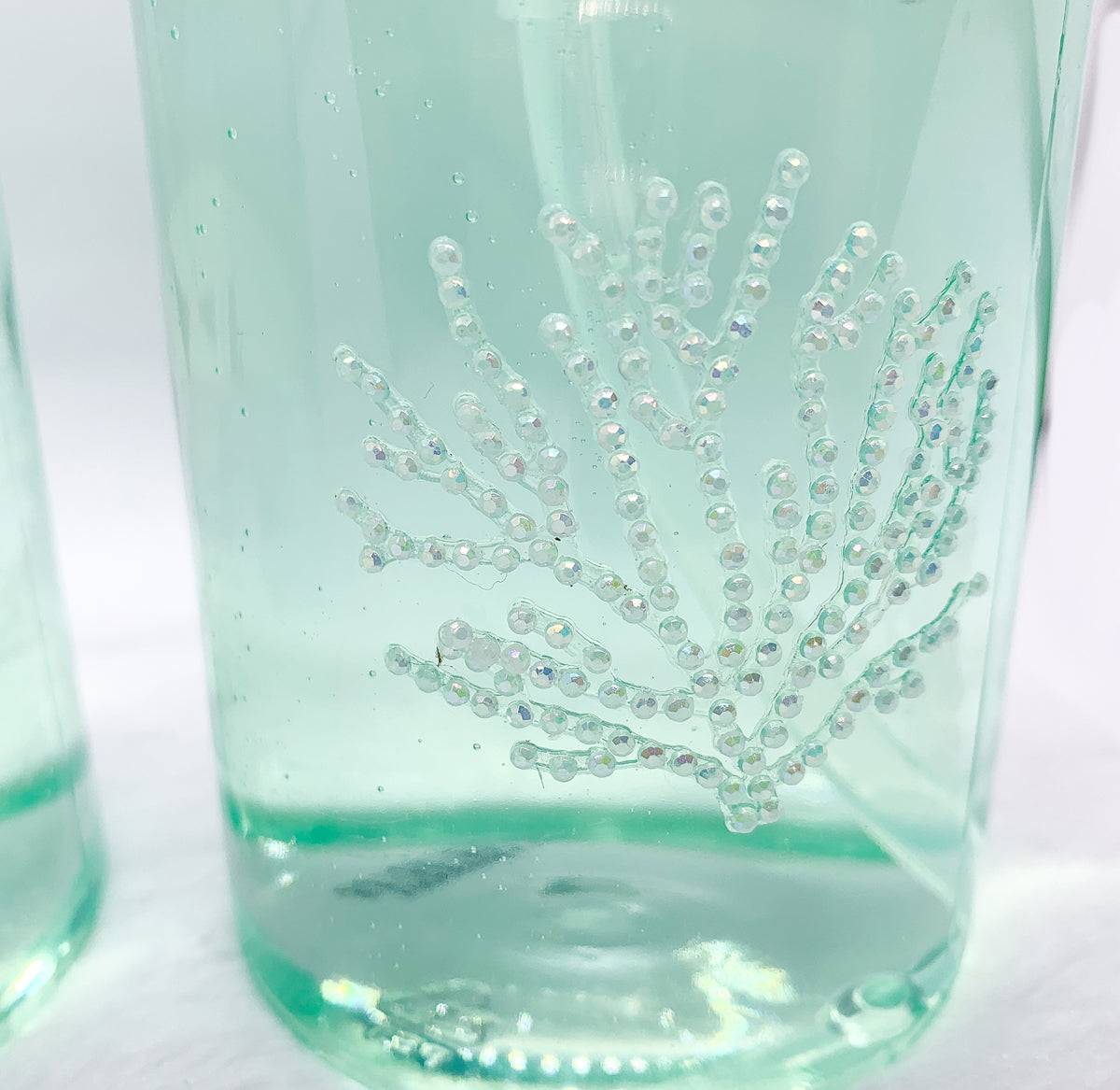 Photo encouraging users to save the planet by choosing a durable, eco-friendly glass soap pump over disposable plastic.