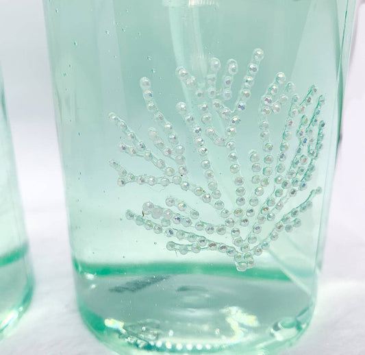 Photo encouraging users to save the planet by choosing a durable, eco-friendly glass soap pump over disposable plastic.