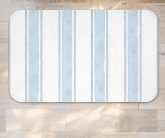 Striped light blue coastal bath mat with soft cotton texture
