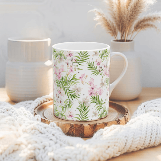 Tropical floral coffee mug with pink and green flowers for beach lovers.