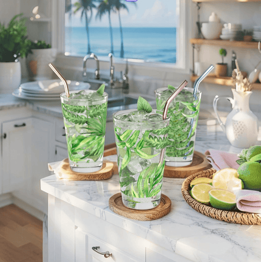 Tropical palm print glass cup for summer drinks and beach-themed decor.