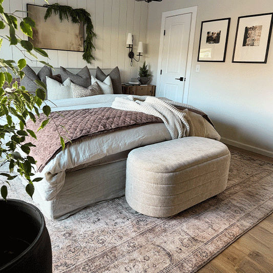 Two-piece upholstered nesting storage bench set in neutral fabric.
