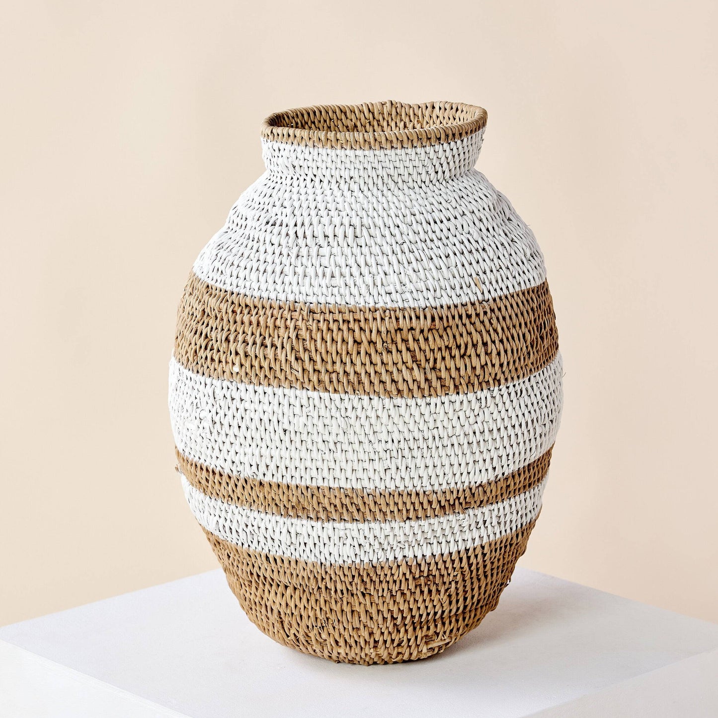 Boho living room setting with African artisan handwoven basket.